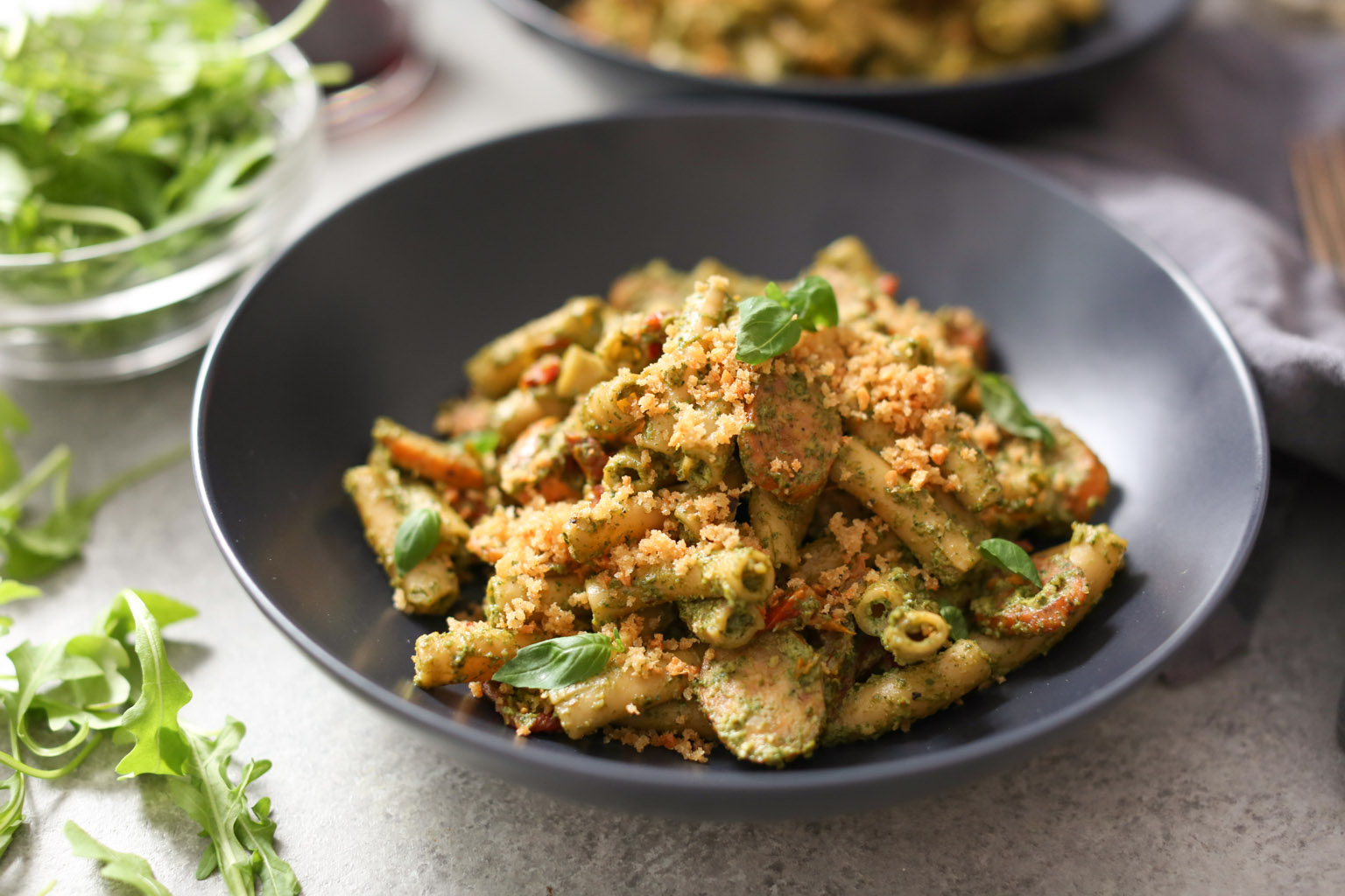 Sausage and Sun-Dried Tomato Pasta with Arugula-Goat Cheese Pesto